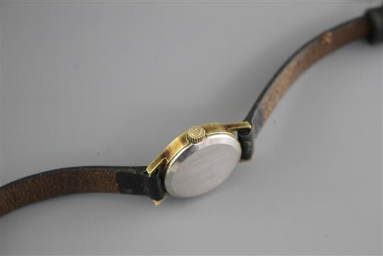 A ladys steel and gold plated Omega manual wind wrist watch, on associated leather strap.